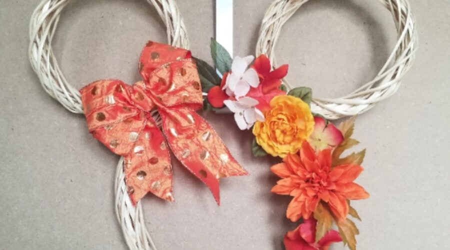 mickey mouse form wreath with artificial flower and ribbon accents in fall colors www.emjaybeedesign.com