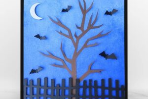 framed paper craft project with bats, a bare tree and fence under moonlight www.emjaybeedesign.com