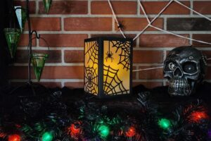 glowing spider web spooky paper lantern on mantle www.emjaybeedesign.com