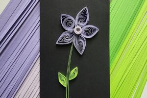 Quilling paper flower art featured image purple flower green stem and leaves paper strips quilling project www.emjaybeedesign.com